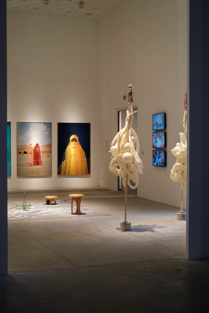 Explore a modern art gallery showcasing unique sculptures and captivating photography.